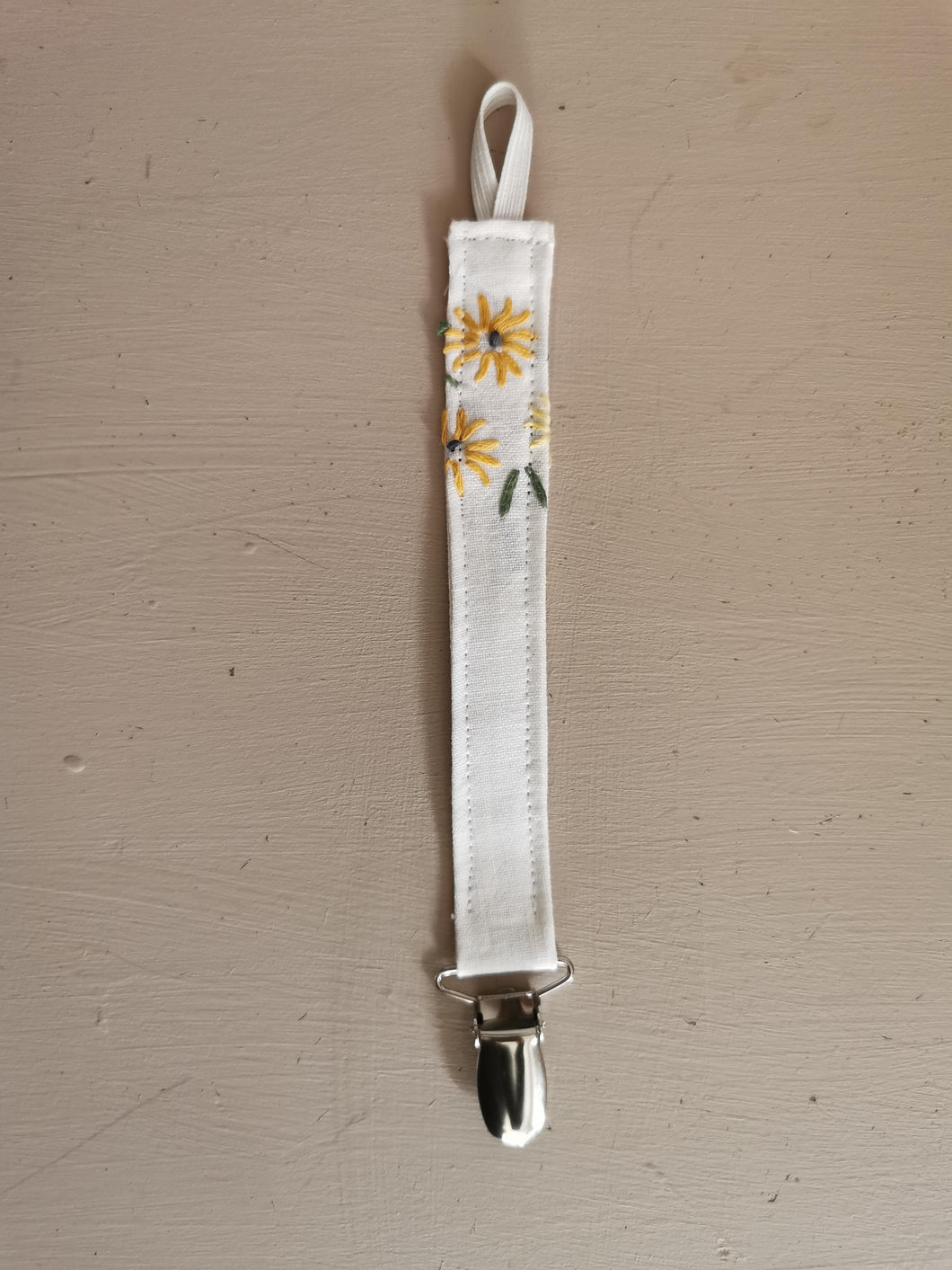 Suttesnor broderede blomster