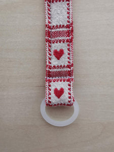 Suttesnor vævet rødt og hvidt med hjerter (gummiring)